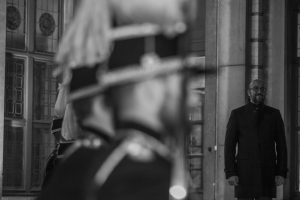 Prime Minister Michel with the guards in black and white